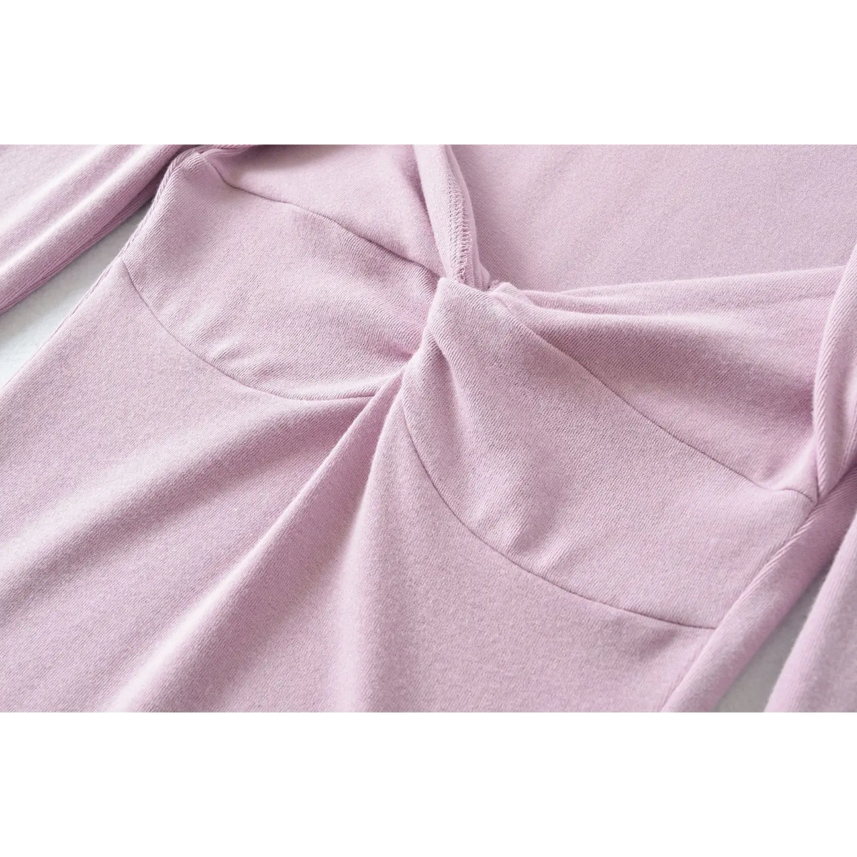 Close up of front twist bust stitching, molded bust seam of lilac women long sleeve top