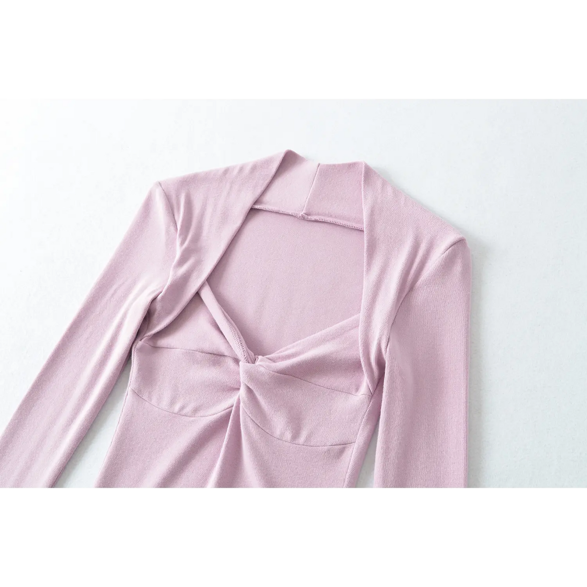 Close up of lilac long sleeve top, front twist bust design, halter neckline, soft stretch knit fabric
