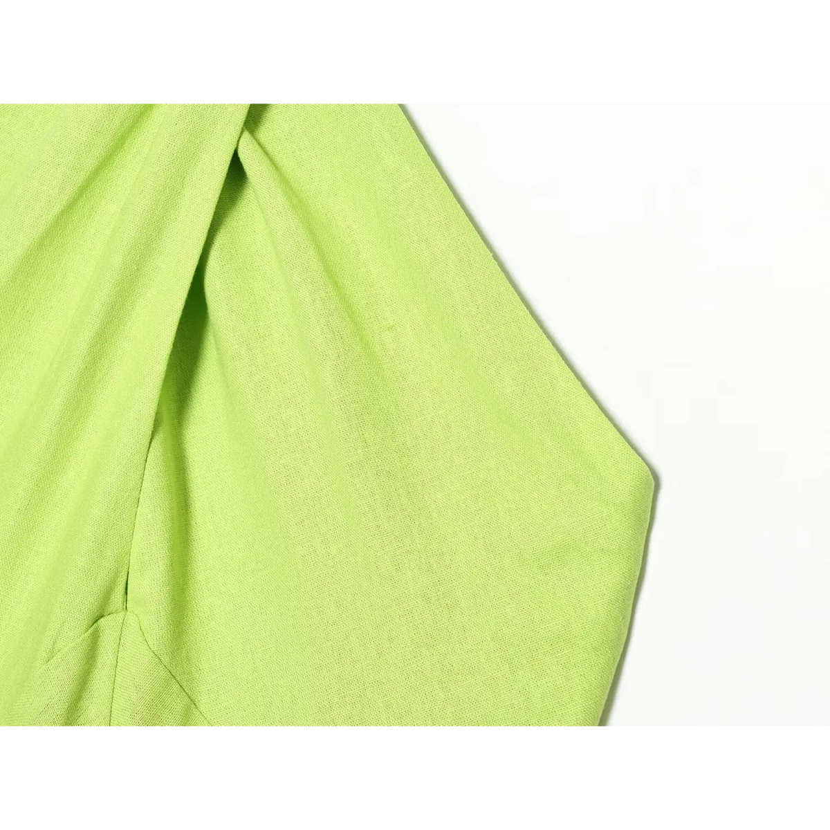 Close-up of lime green armhole and linen fabric texture