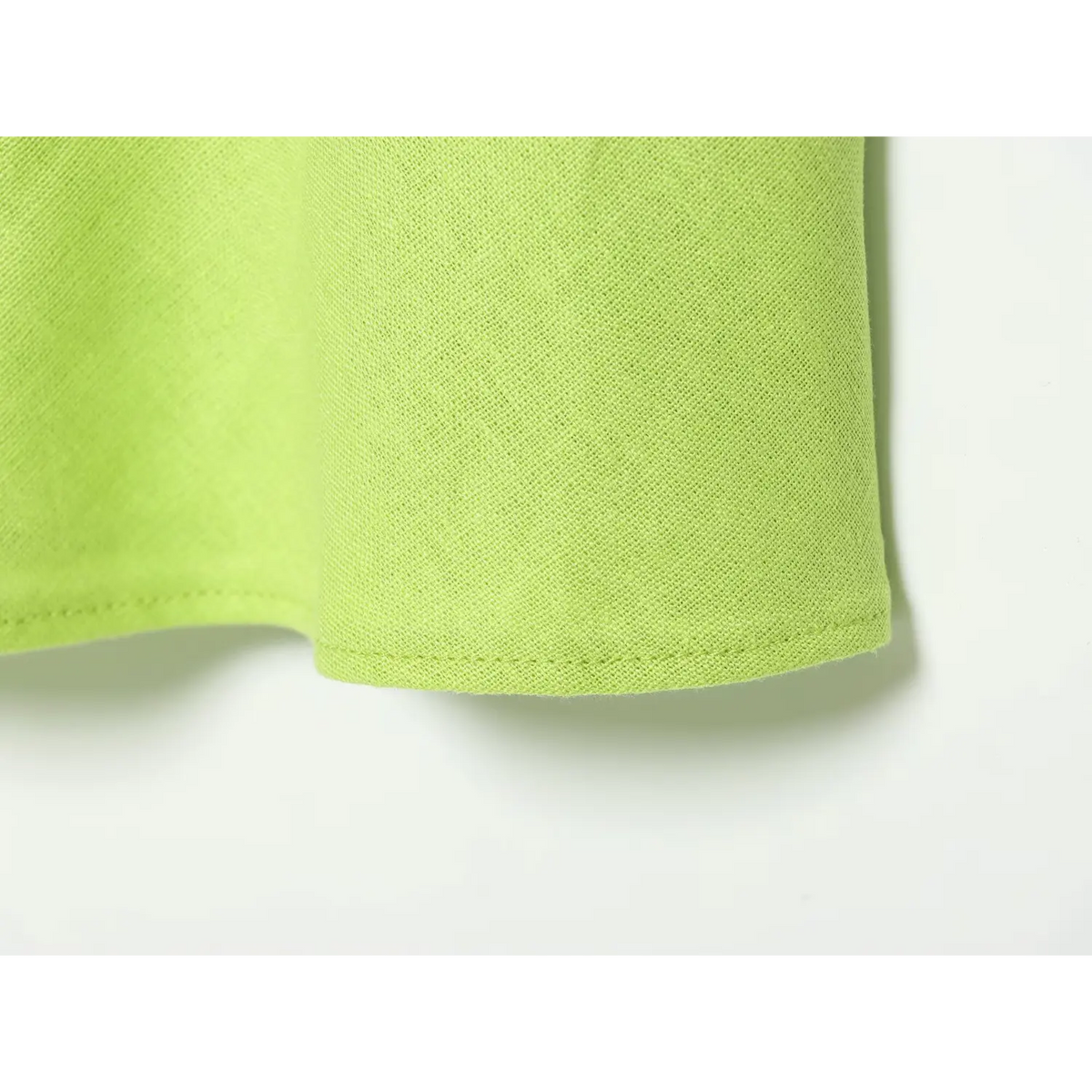 Close-up of lime green maxi skirt hem stitching