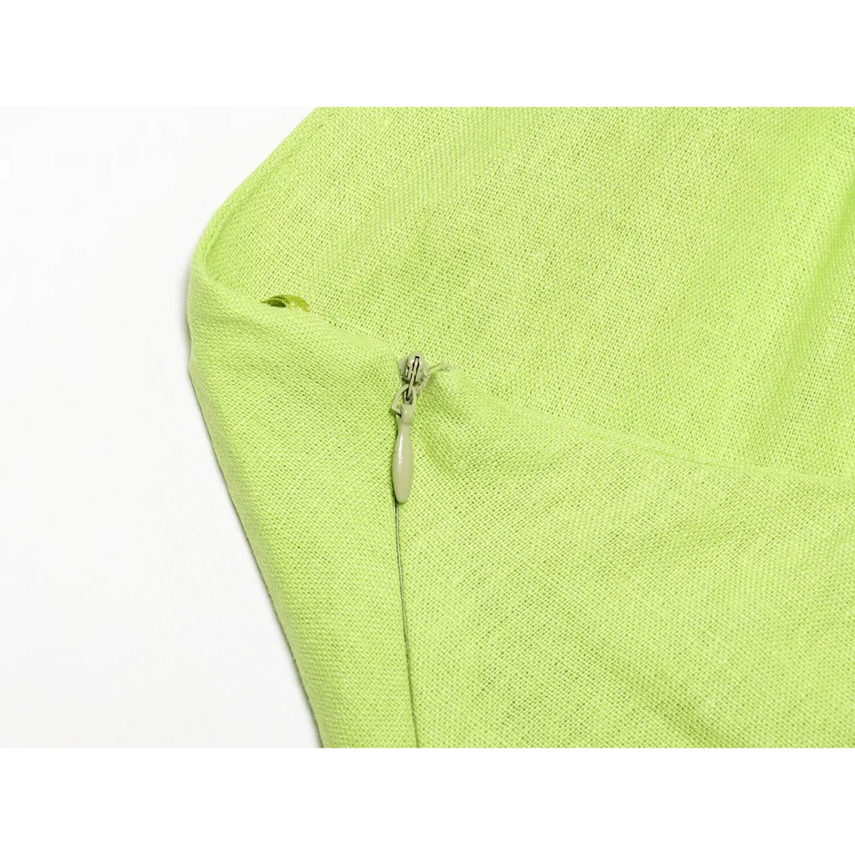 Close-up of lime green side zip