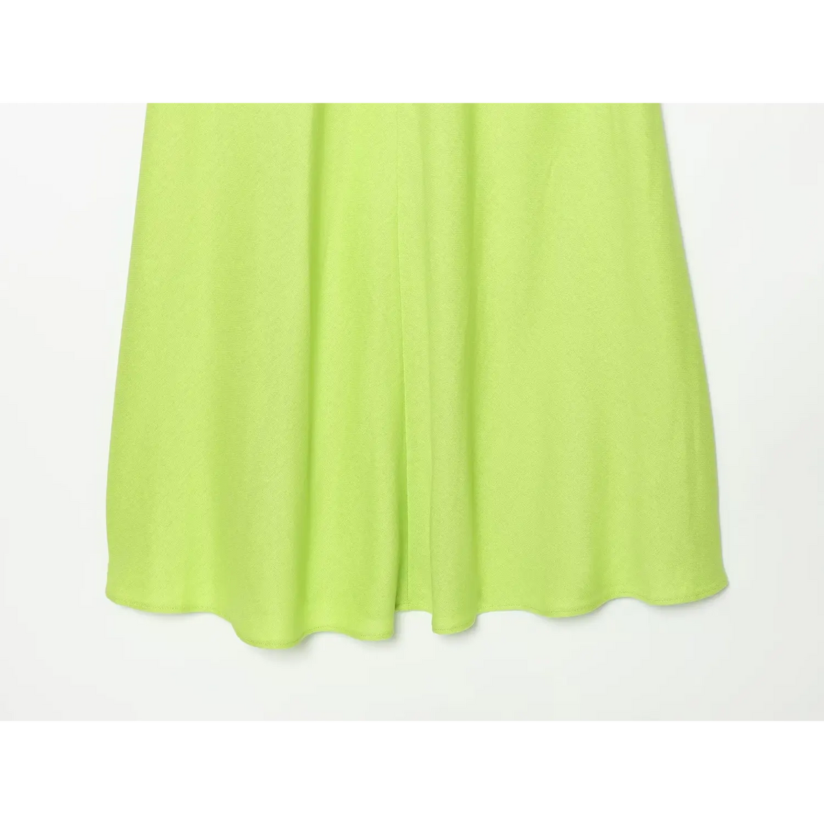 Close-up of lime green A line maxi skirt and fabric