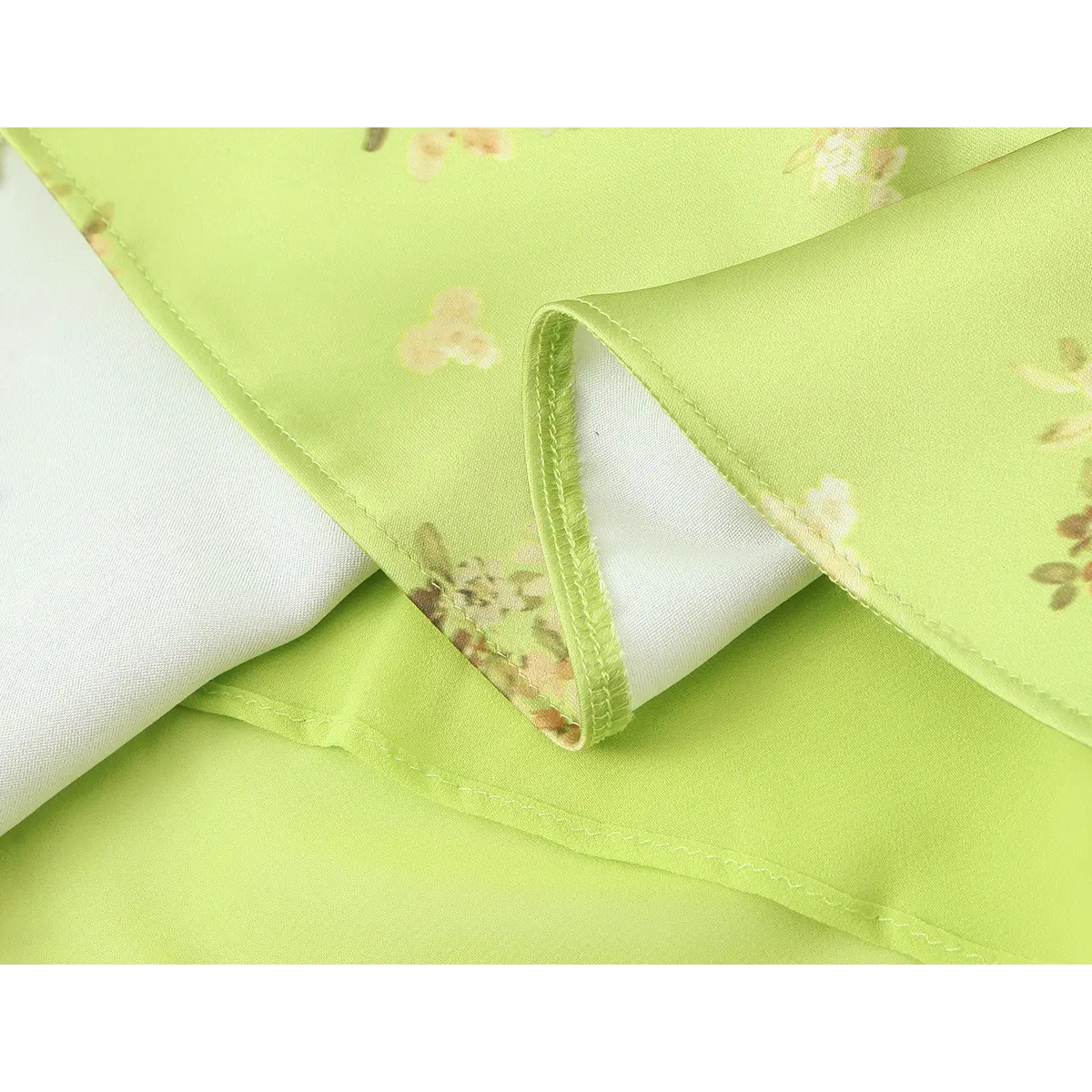 Close-up of the dress lining, showing the double-stitched hem and soft white inner fabric