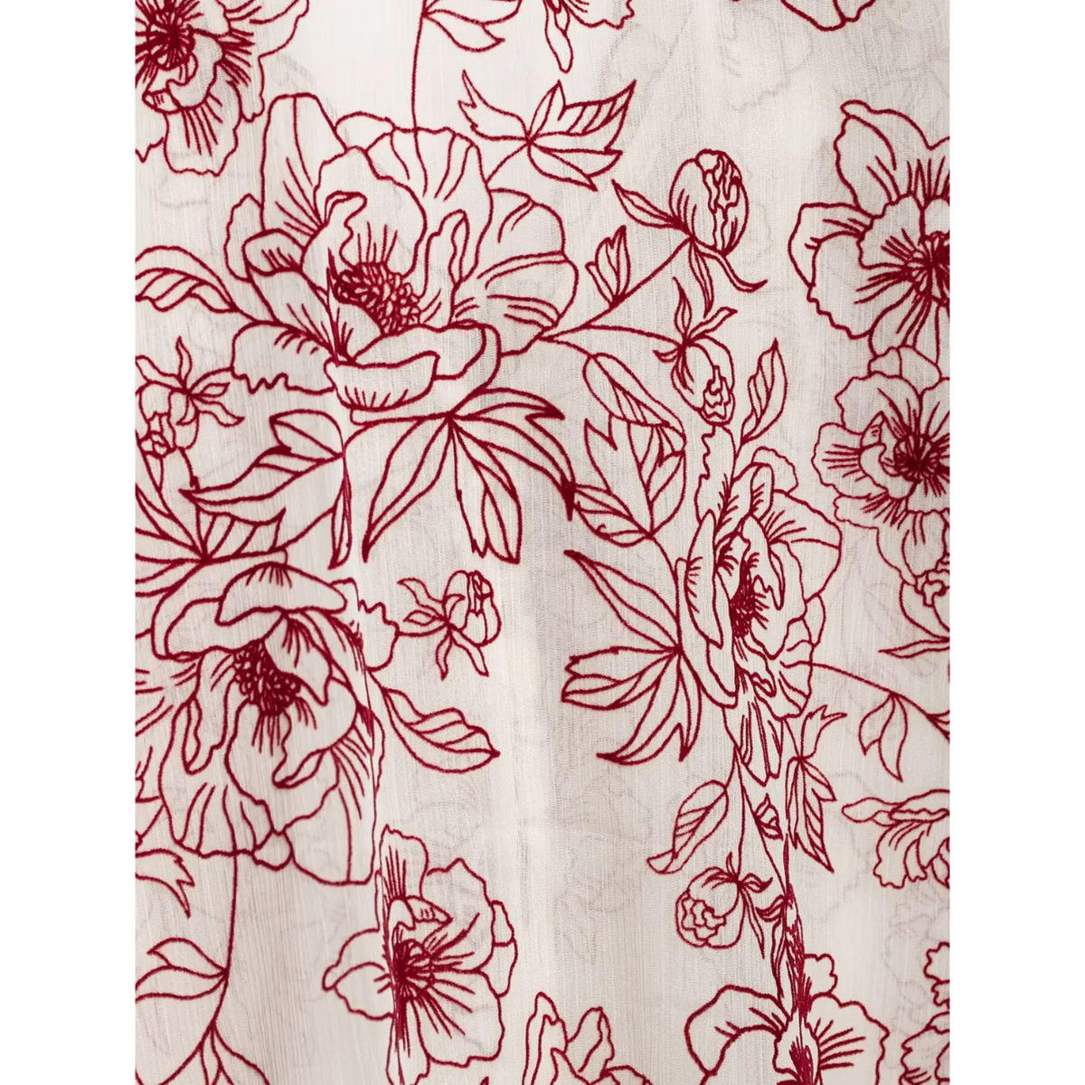 Close-up of line art floral print on chiffon fabric