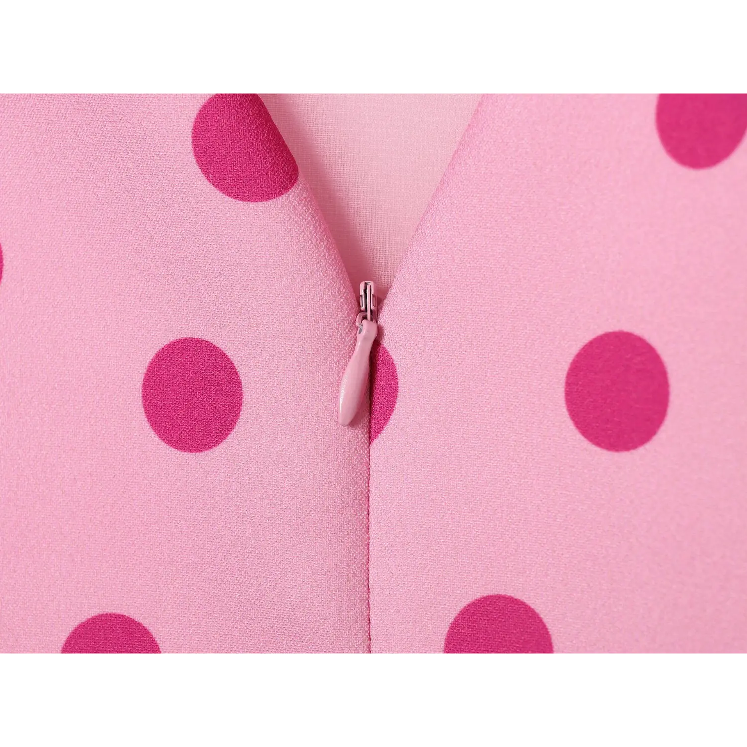 Closeup pink invisible zipper at center back v opening