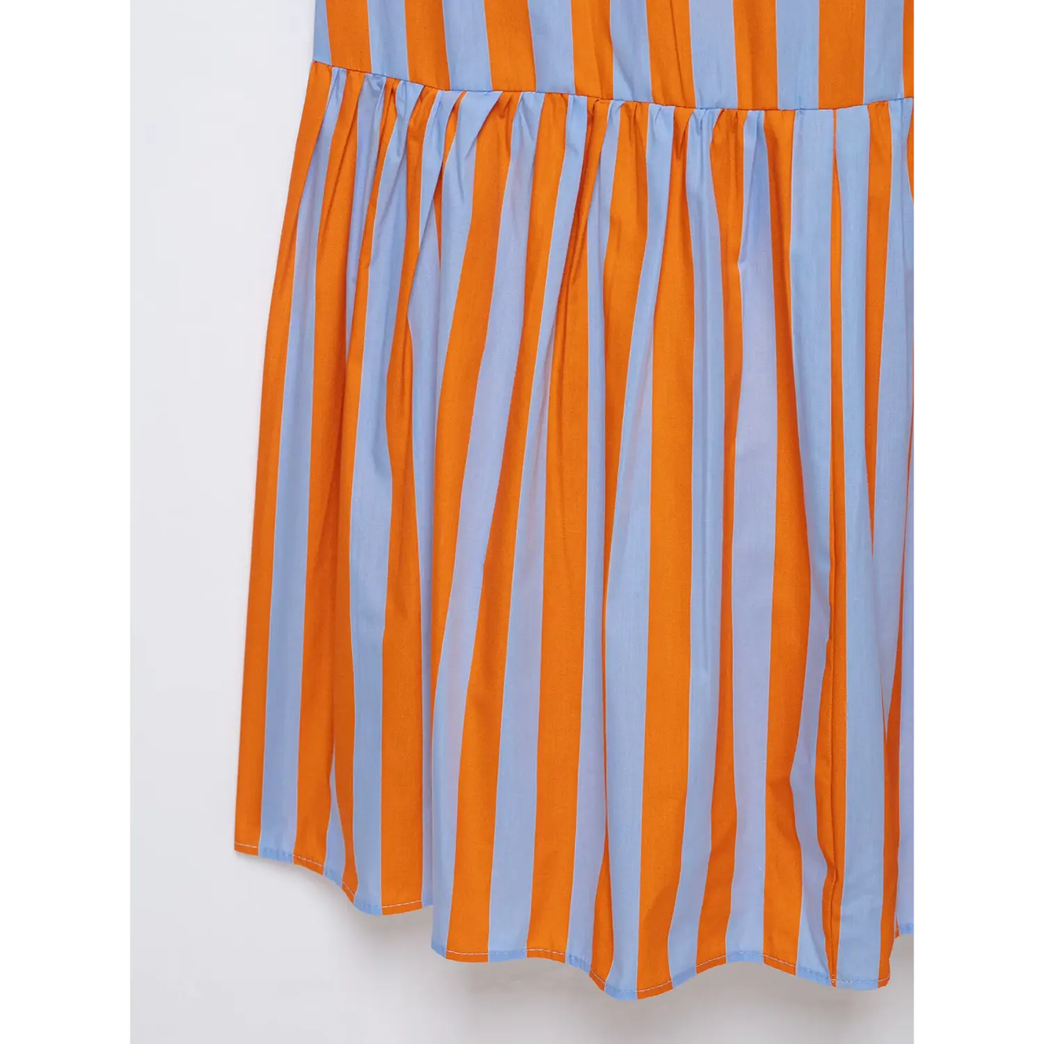 Detail shot gathered ruffle hem of orange and light blue vertical stripe long maxi dress
