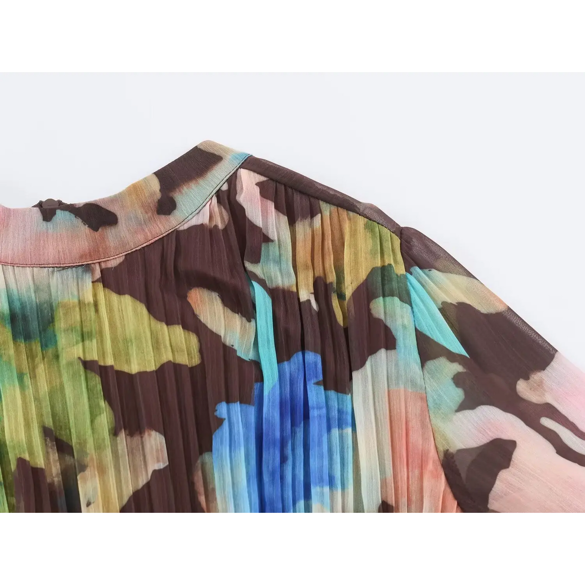 Close-up of shoulder seam and gathered pleated sleeve on multicolor watercolor maxi dress