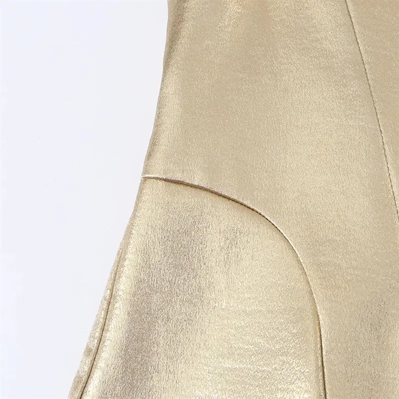 Waist side closeup curved contour panel stitching, tailored corset shaping, shiny metallic fabric texture
