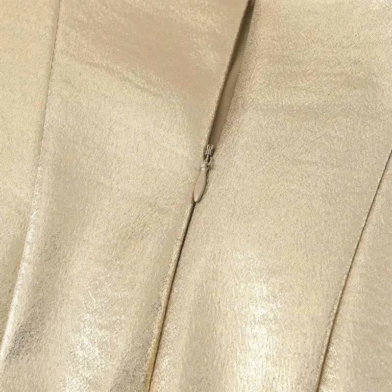 Macro shot rear invisible matching gold zipper, fine teeth and fabric tape matching dress metallic material
