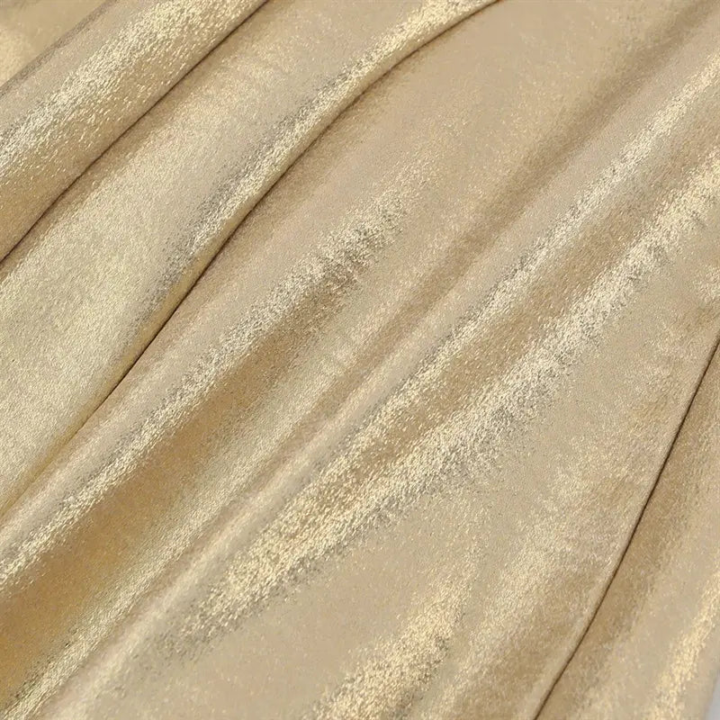 Full fabric texture closeup, metallic gold coated woven material with subtle crinkle sheen finish