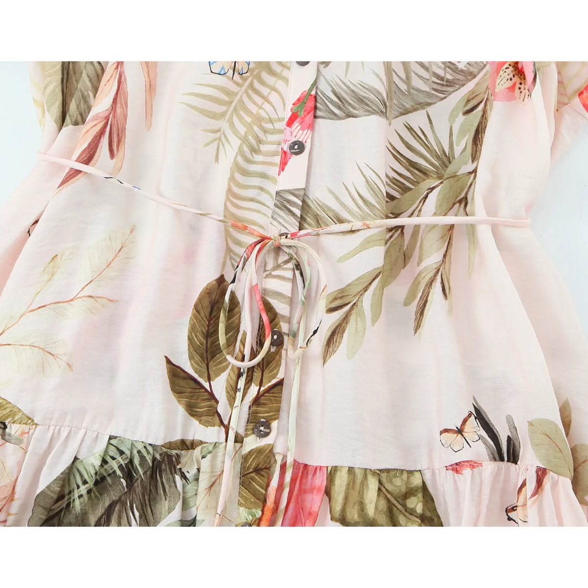 Waist self tie belt and front button detail on pink tropical leaf print midi dress