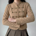 Model wearing khaki faux suede military cropped jacket, lifestyle front outfit shot