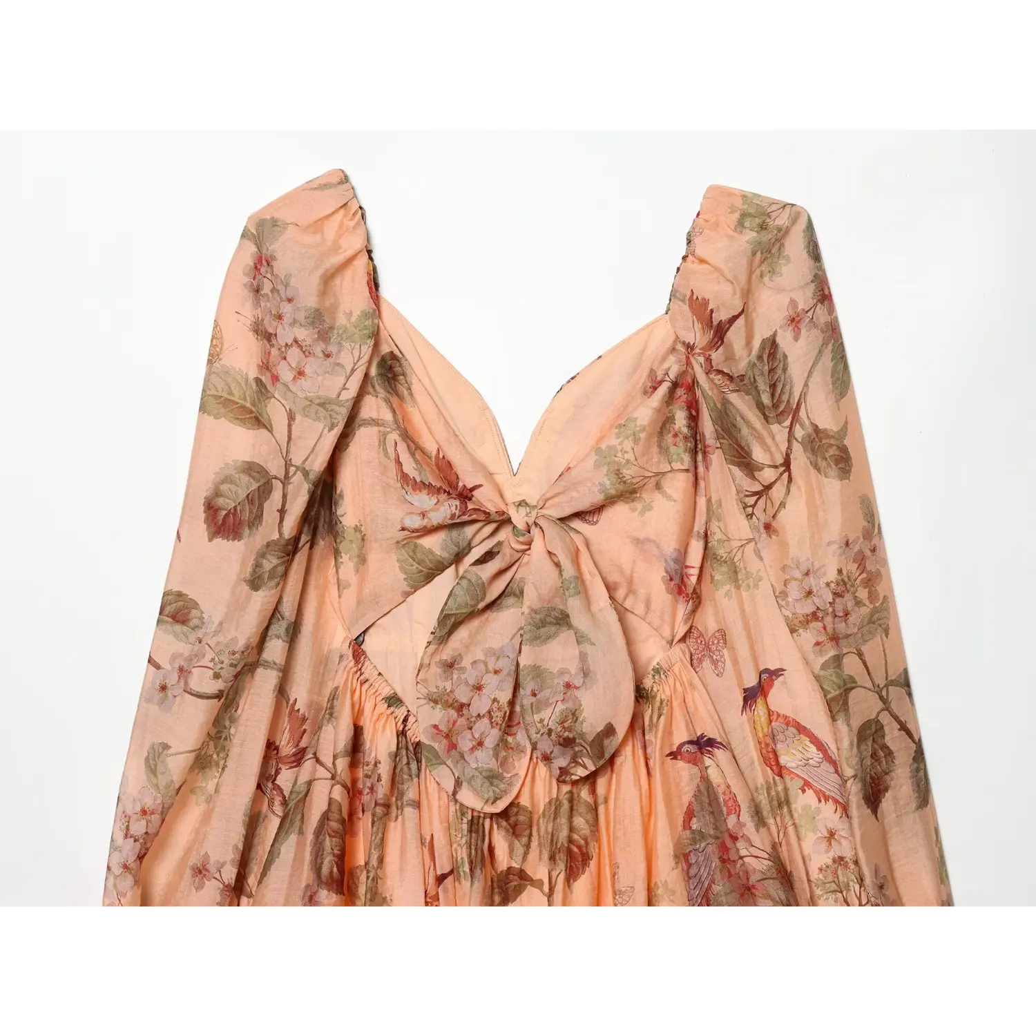 Top‑down close‑up of back decorative tie bow, open v‑back, matching botanical bird‑and‑butterfly print