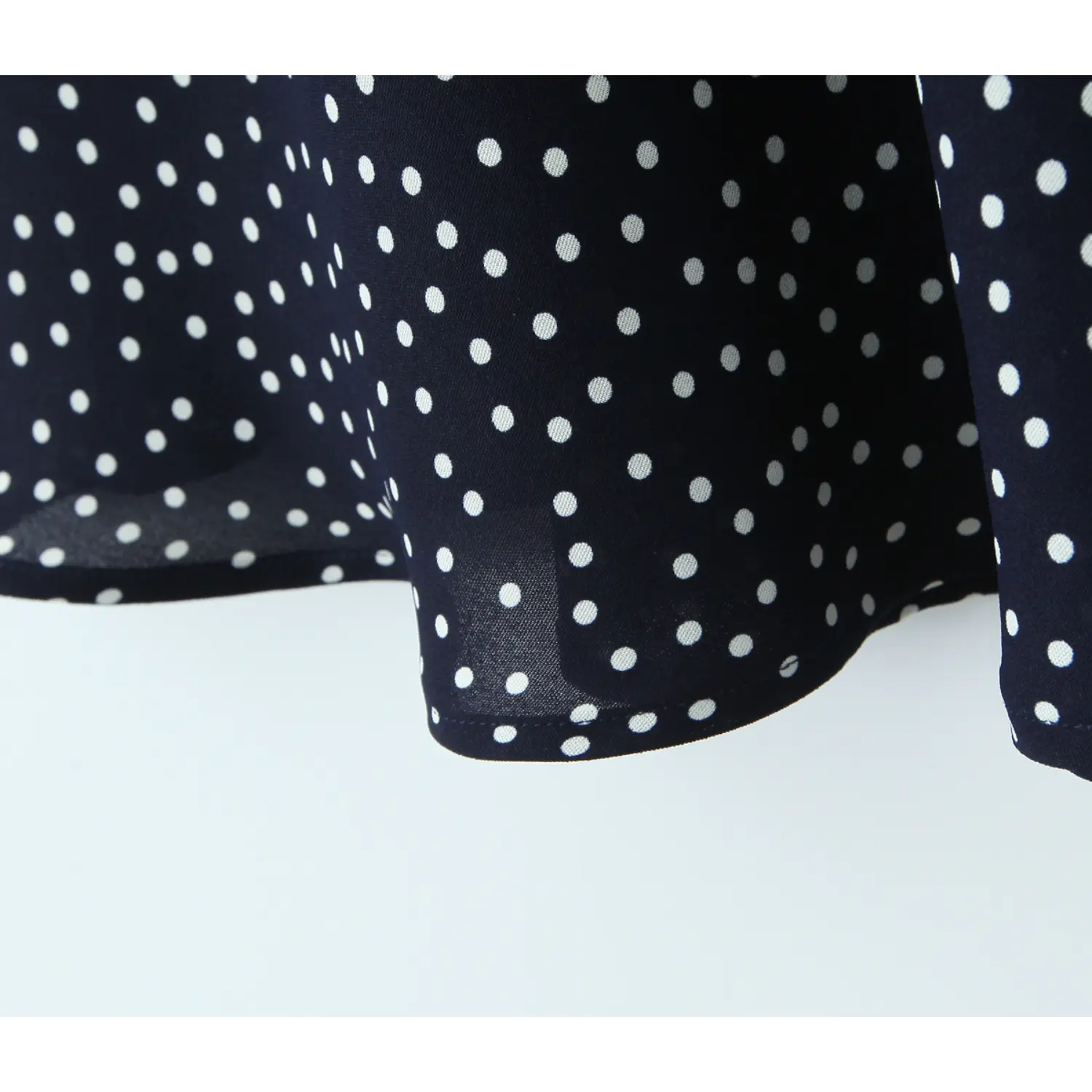 Mini skirt single layer hem polka dot fabric flat overview shot, lightweight breathable chiffon smooth binding loose A-line drape skirt display