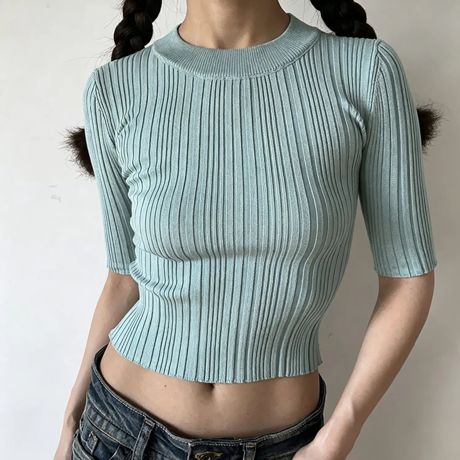 Model front view, mint green crew neck mid sleeve ribbed knit crop top, slim fitted cropped silhouette