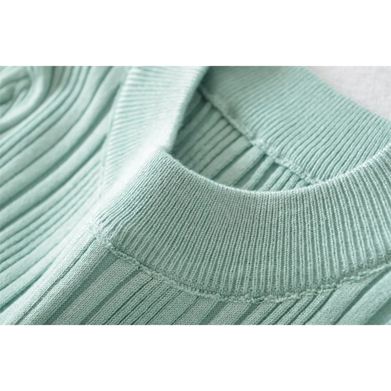 Inner collar closeup, mint crew neck vertical rib knit top, fine sewing craftsmanship