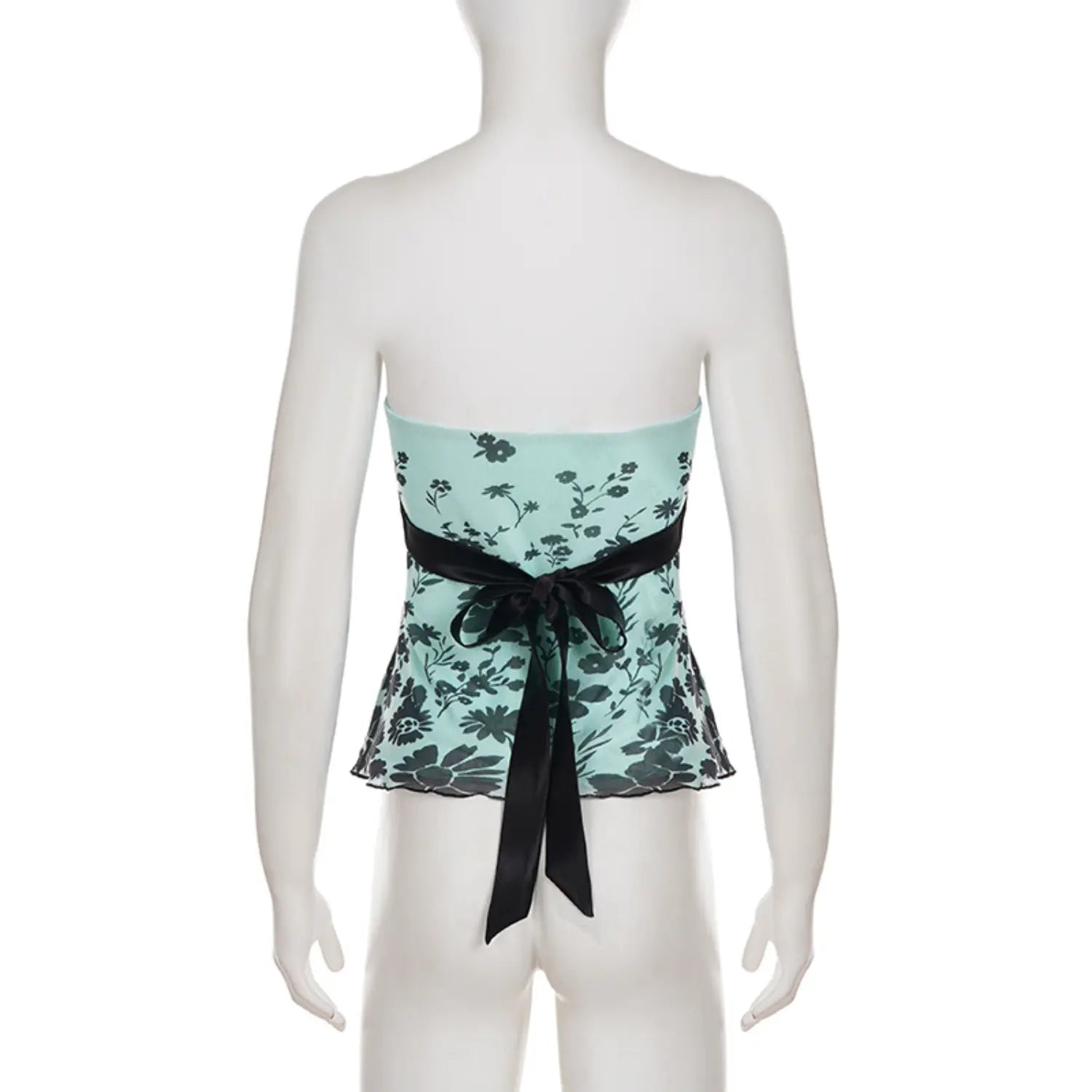 Full back white studio mannequin shot of strapless mesh tube top, elastic gathered bust band, wide black satin waistband with large back bow, scalloped ruffled mesh mini peplum hem, allover dark floral print on mint base