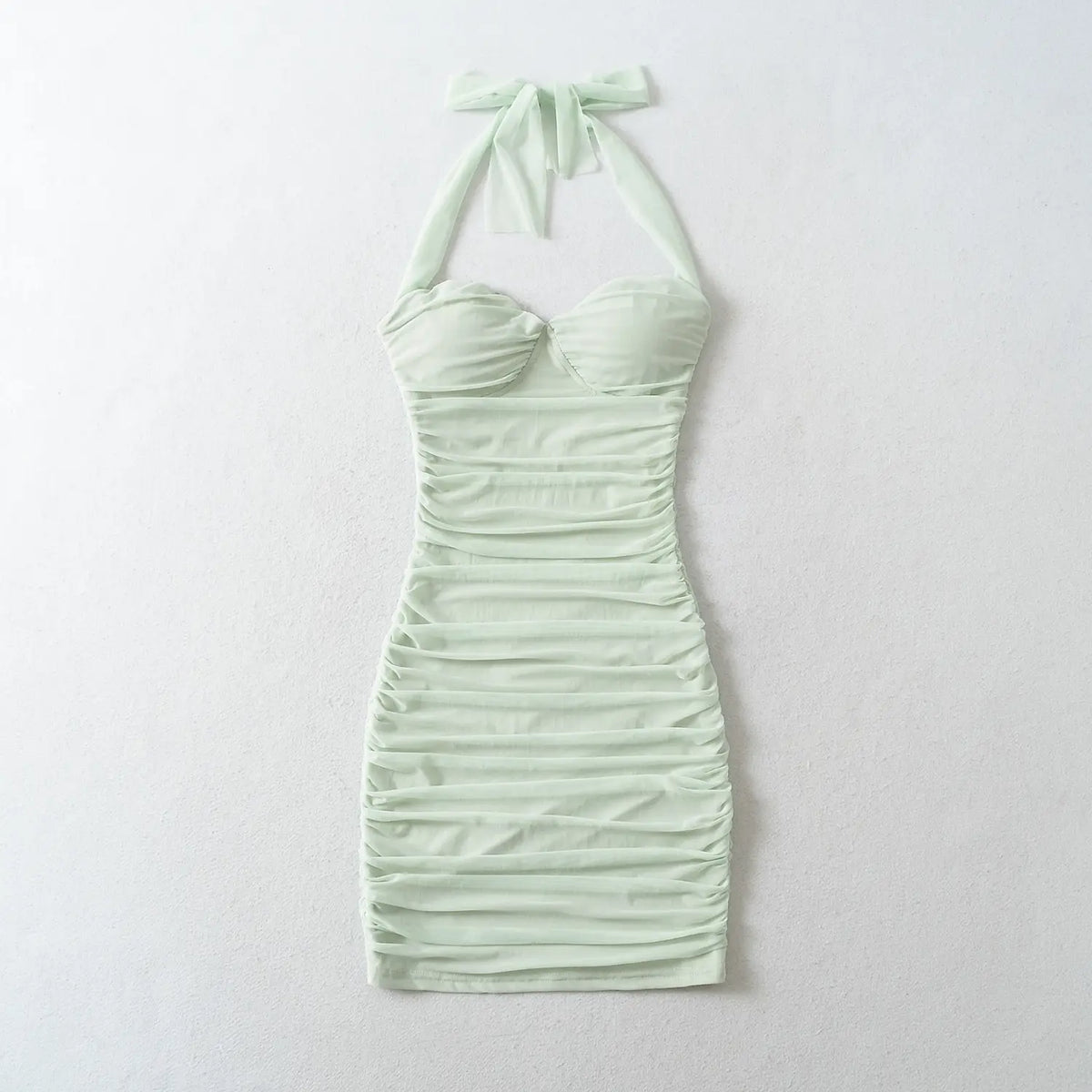Mint Green halter ruched bodycon mini dress flat lay, white background, sweetheart neckline, all-over horizontal ruching