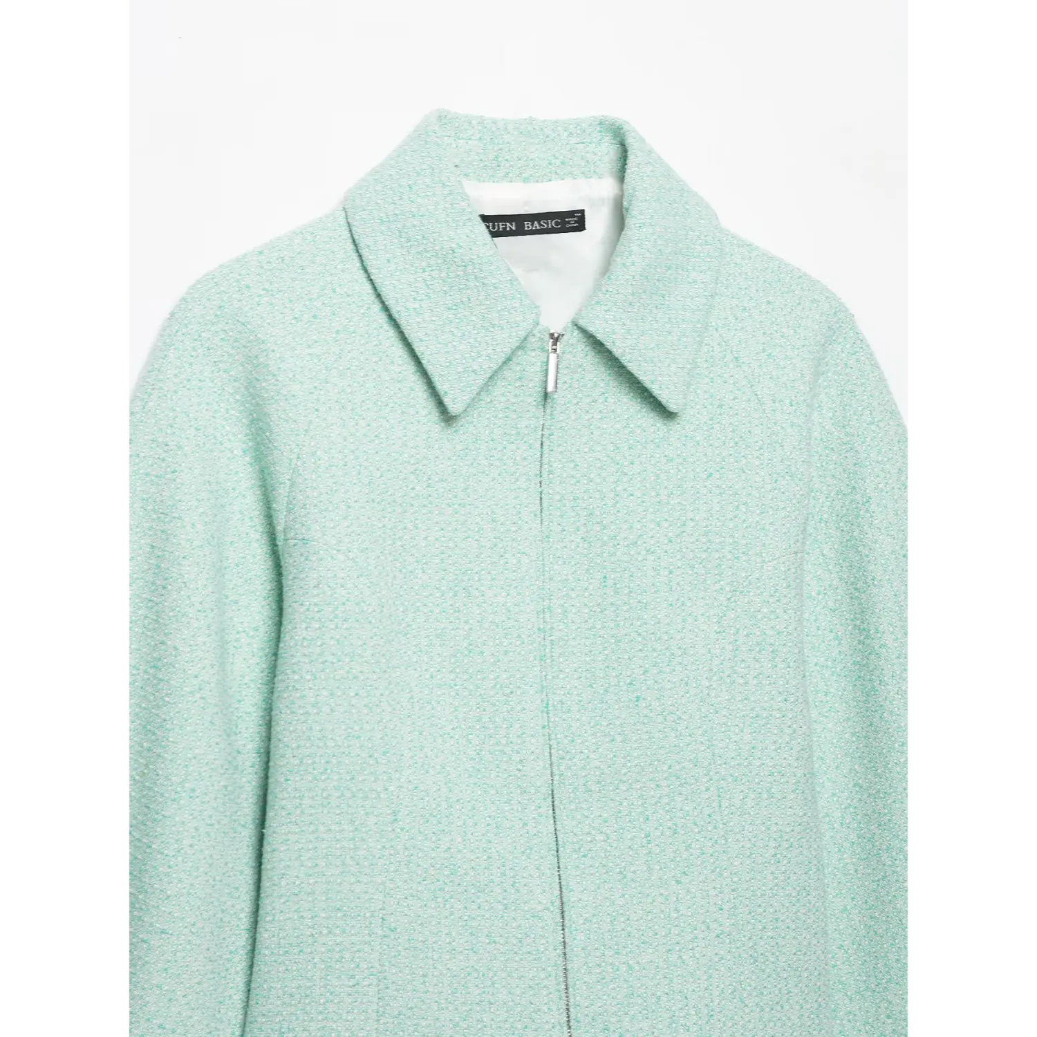 Front view mint tweed collared short jacket, central silver zipper closure, inner label visible