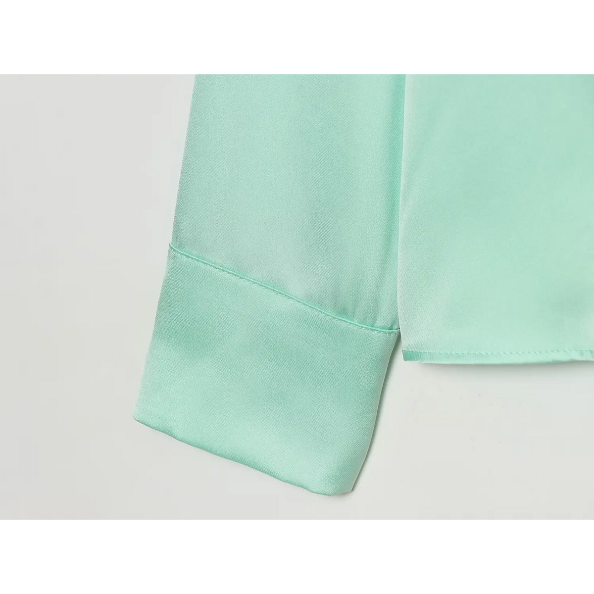 Close-up of cuff and hem stitching