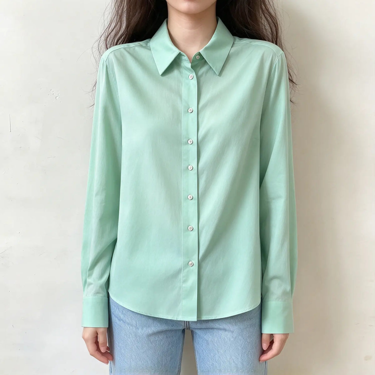 Model wearing mint satin collared button front blouse, front view