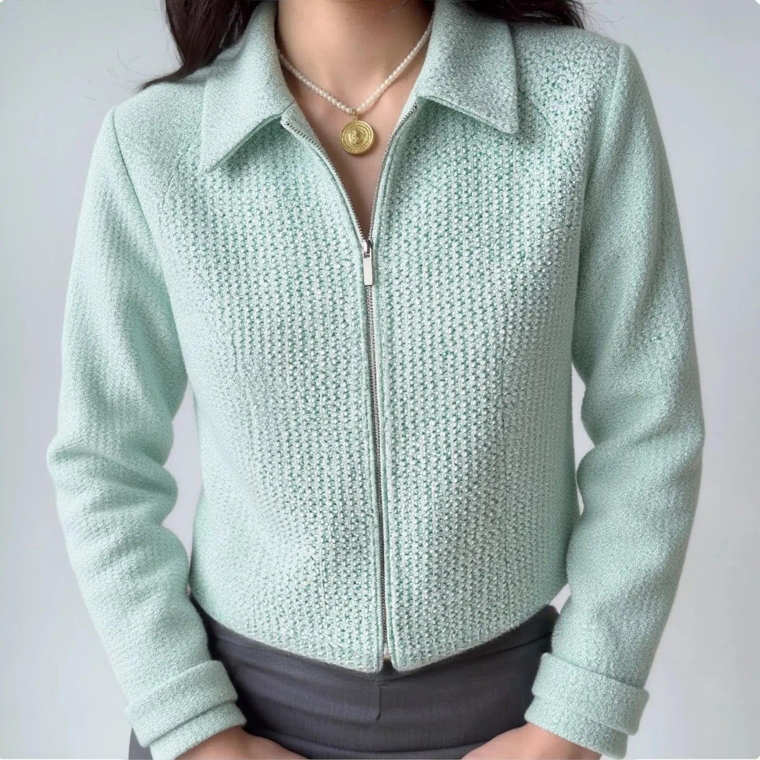 Model wearing mint green collared tweed zip-up cropped jacket daily outfit front view