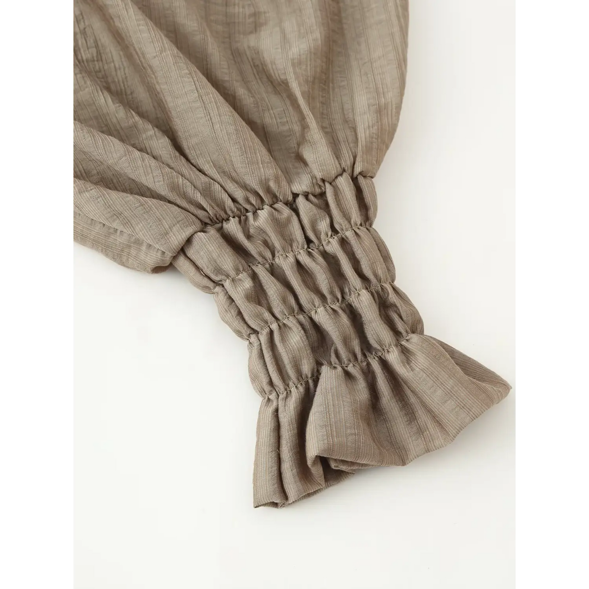 Close-up of elastic ruffle cuff