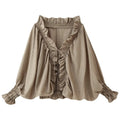 Front flat lay of mocha ruffle tie front smocked blouse