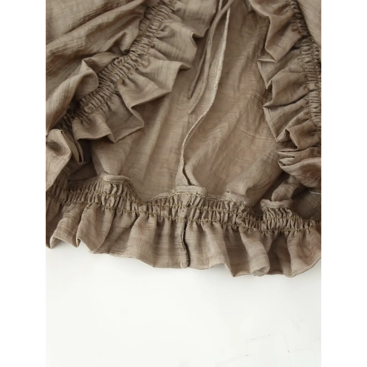 Close-up of elastic ruffle hem