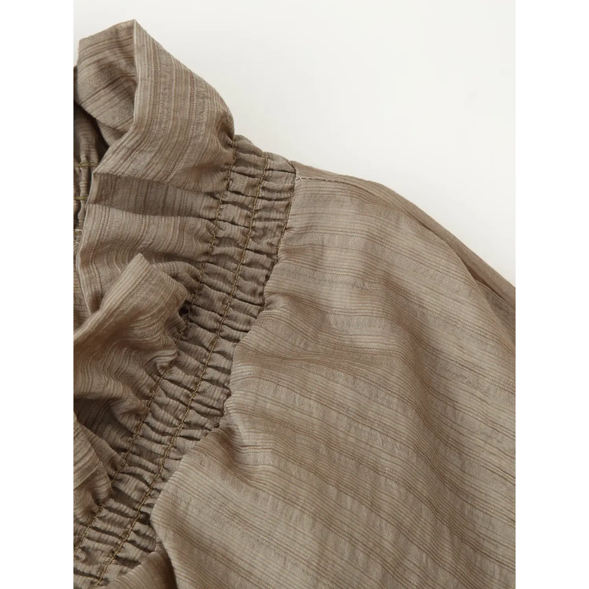 Close-up of shoulder smocked ruffle detail