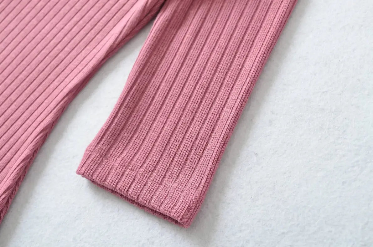 Close-up of ribbed elbow sleeve cuff