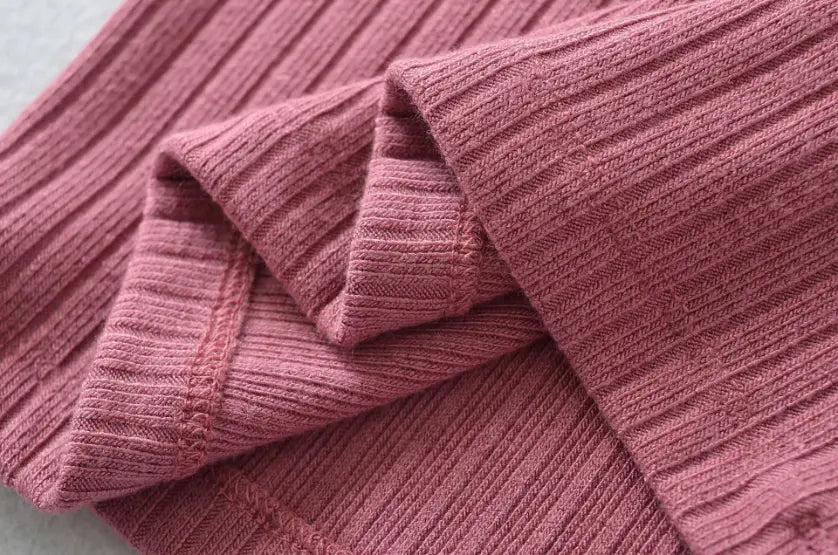 Macro close-up of vertical ribbed knit fabric