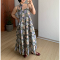 Olive green moon floral vacation cami tiered maxi dress, multi-layer ruffle loose silhouette, model hand on waist full body indoor display shot