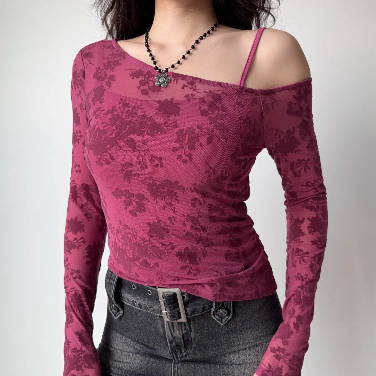Torso front shot mulberry pink floral flock mesh long sleeve top asymmetrical cold shoulder design
