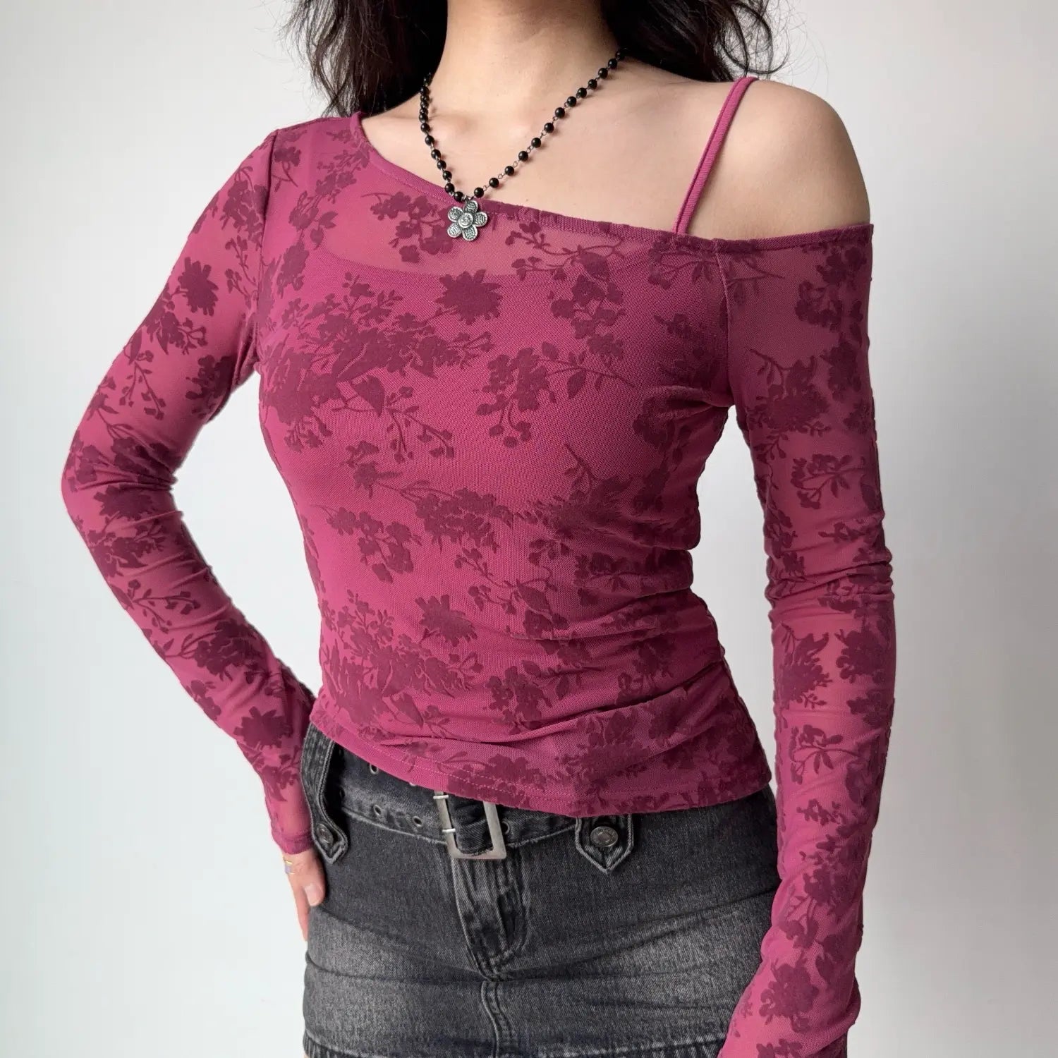 Torso front shot mulberry pink floral flock mesh long sleeve top asymmetrical cold shoulder design