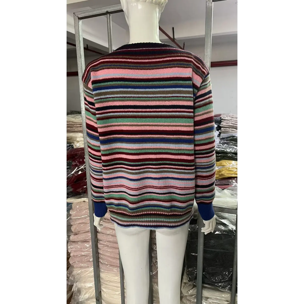 White mannequin back view of multicolor horizontal stripe knit sweater, boat neck, loose fit long sleeve striped jumper