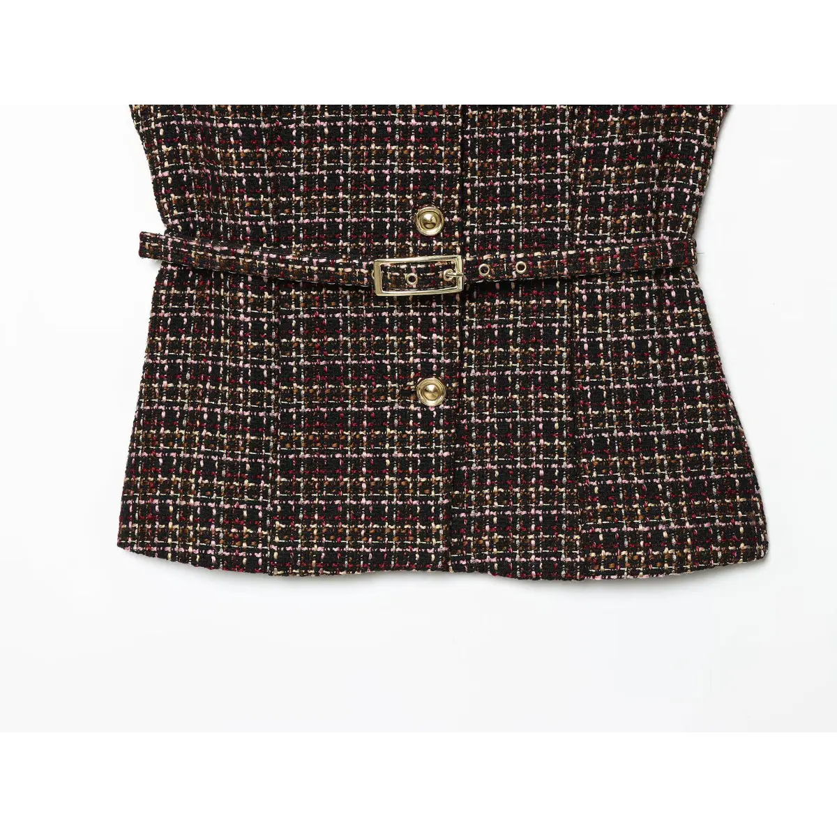 Close-up of the hem on the tweed tunic, showing the textured multicolor weave and tailored silhouette