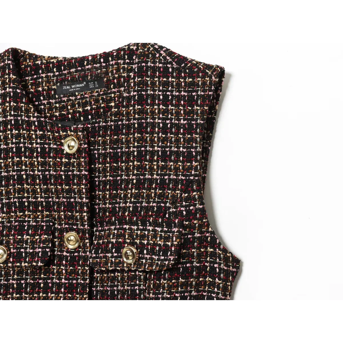 Close-up of the neckline on the tweed tunic, showing the "ZEAL WOMAN" label, round neck, and gold buttons