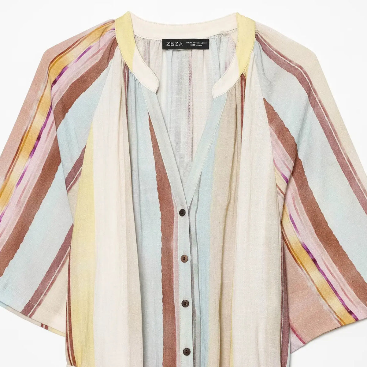Close‑up of collar and button placket on multicolor stripe maxi dress
