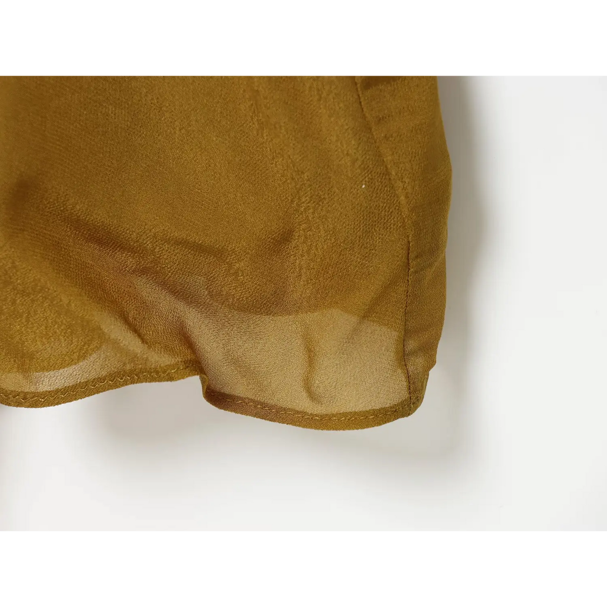 Close-up of sheer hem edge