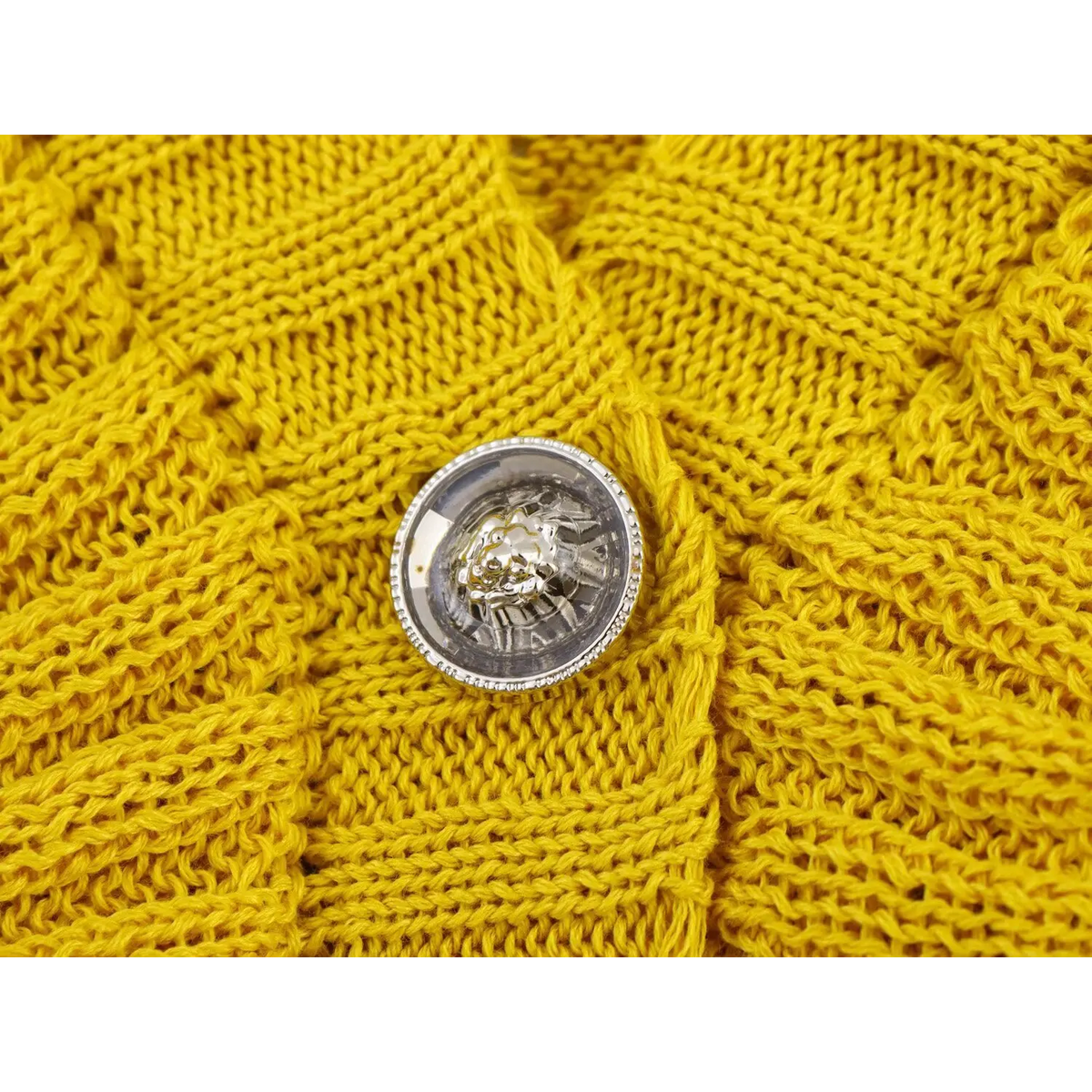 Close-up of embossed metal button