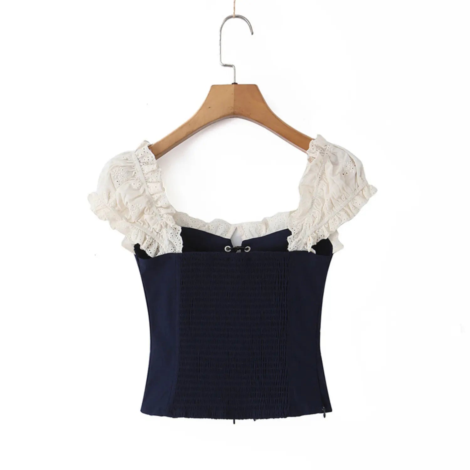 Full back view on white background of the navy blue lace-trimmed corset-style top