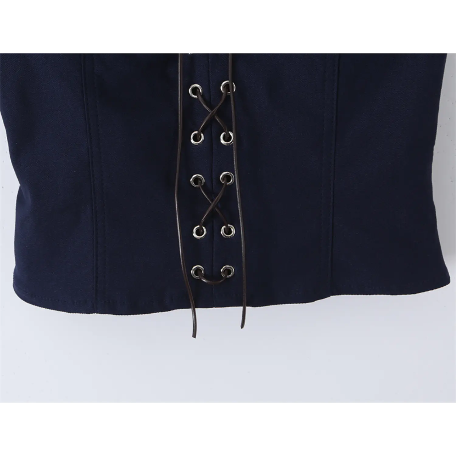 Close-up of the bottom hem and lace-up details on the navy blue corset-style top