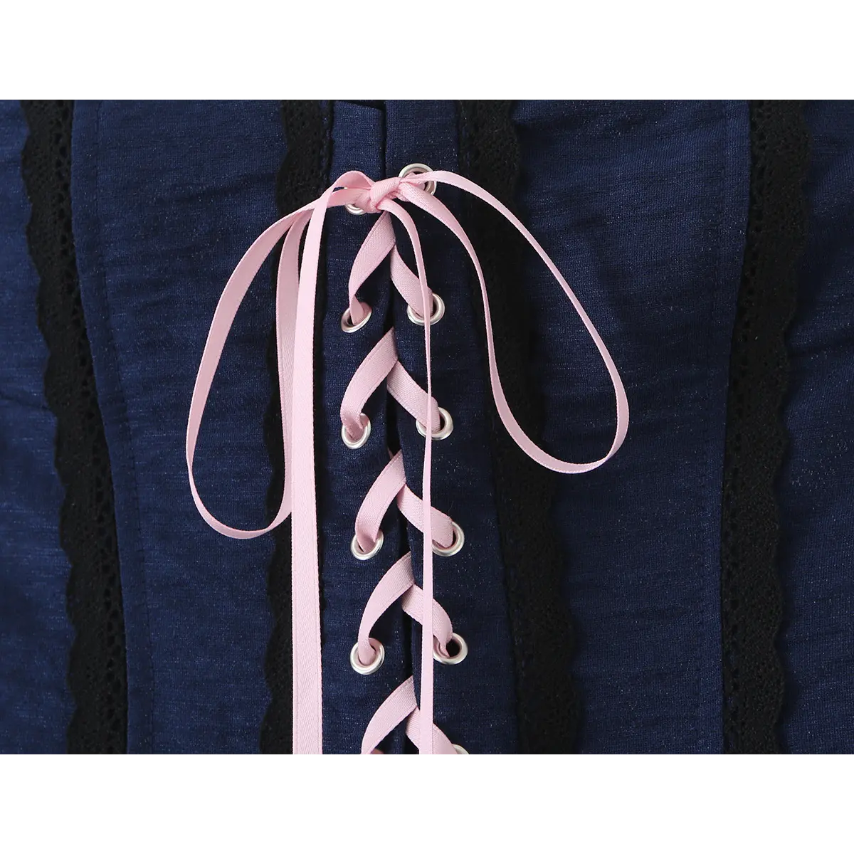  Close-up of the pink ribbon lacing through the metal eyelets.