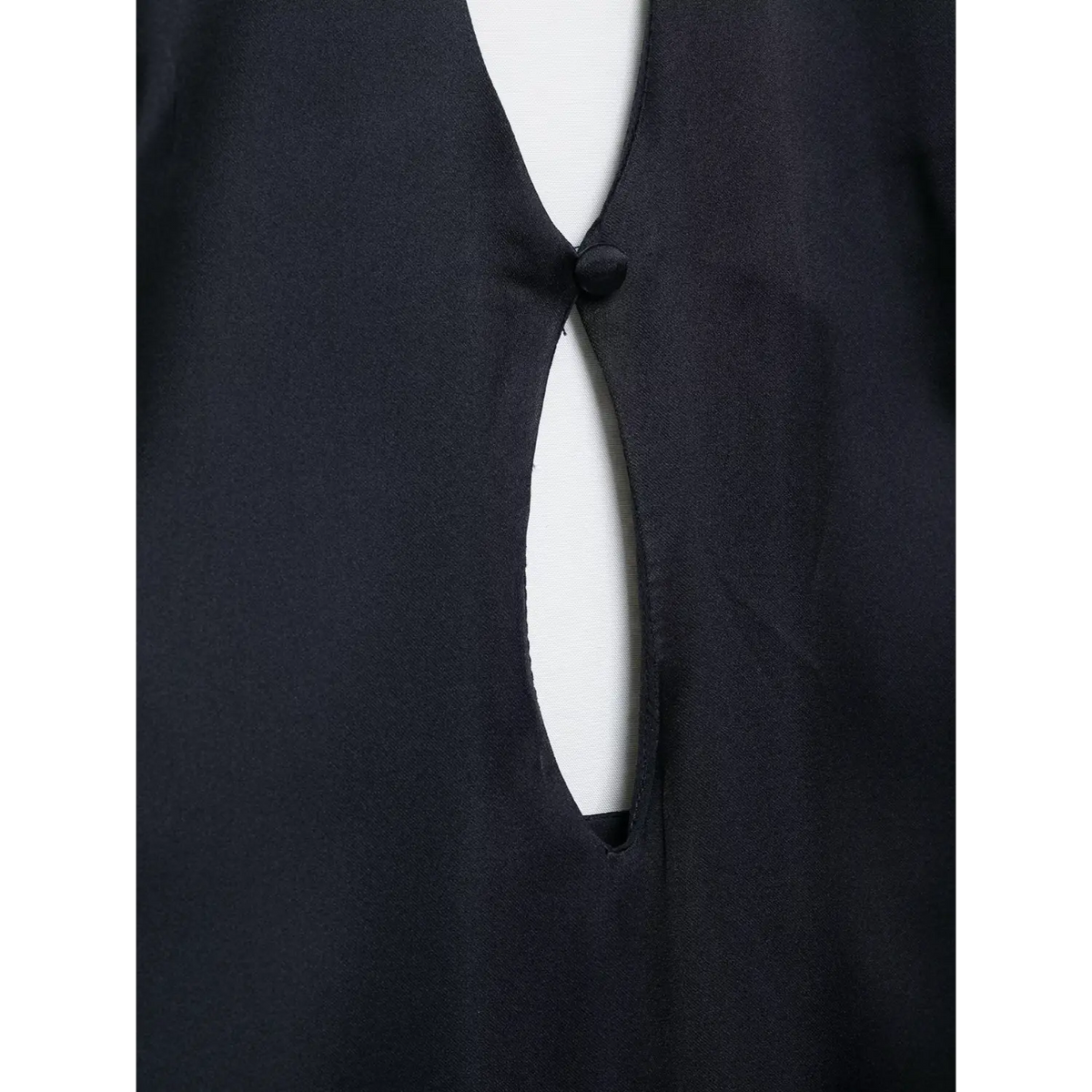 Close-up of bodice keyhole cutout and covered button