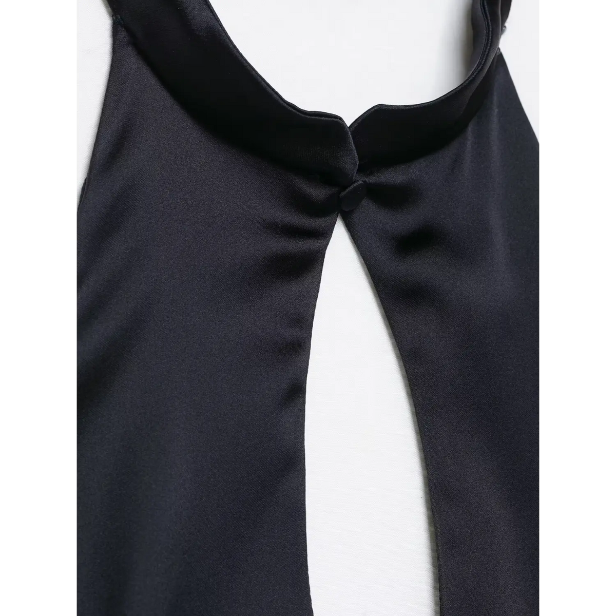 Close-up of covered button at halter neckline