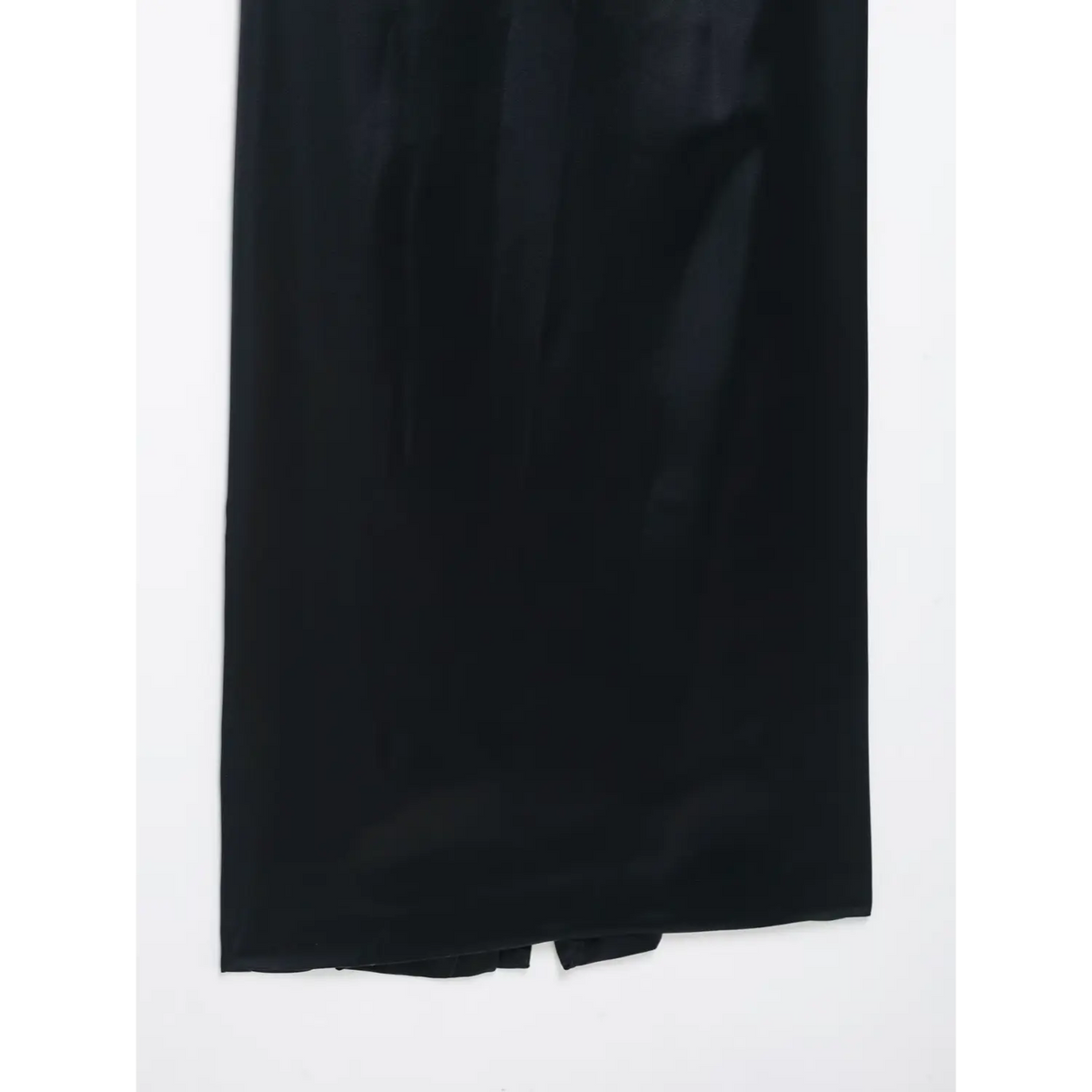 Close-up of flowing navy blue satin skirt fabric