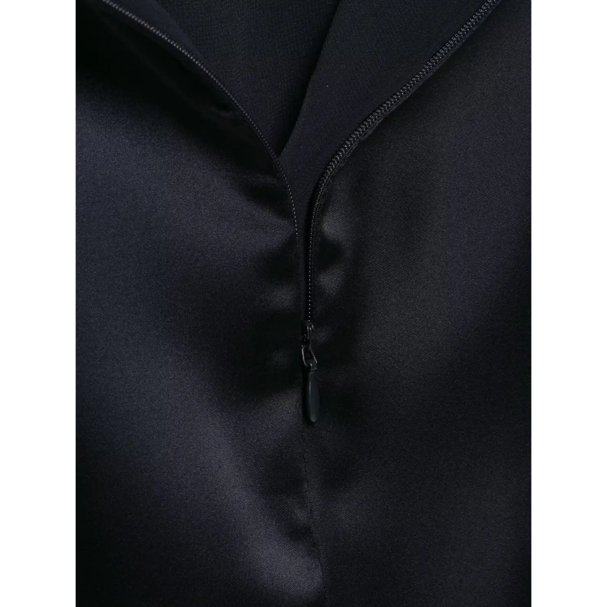 Close-up of front placket zipper on navy blue satin halter maxi dress