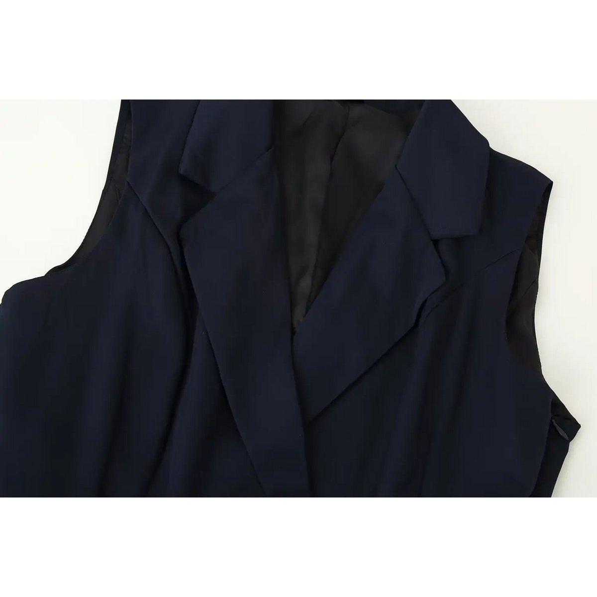 Close-up of blazer collar and wrap V neck
