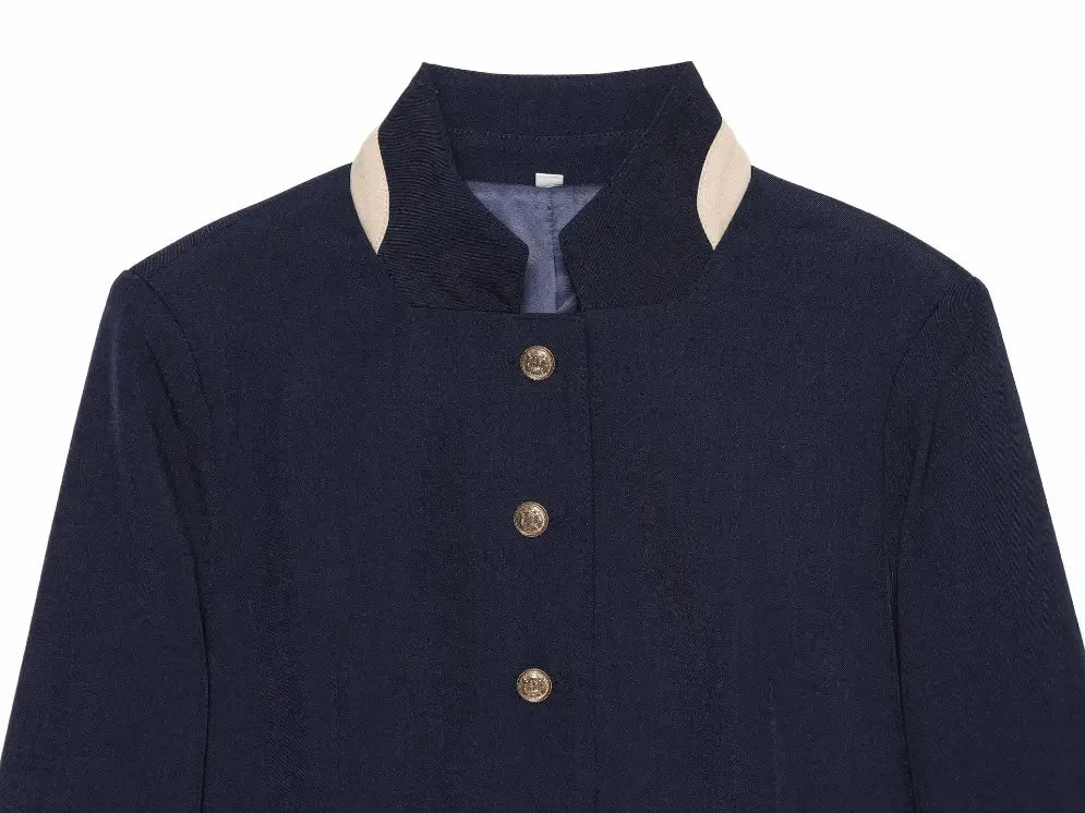 Close-up of stand collar and gold button placket